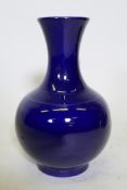 A Chinese deep blue glaze vase, six character mark to base, 34cm high