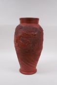 A Japanese redware vase with raised dragon decoration, impressed mark to base, 30cm high