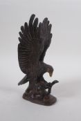 A cast bronzed metal eagle, 19cm high