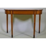 A Georgian inlaid satinwood console table with break front, raised on square tapering supports,