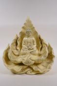 A Chinese blanc de chine porcelain figure of Buddha seated within a blooming lotus flower, impressed