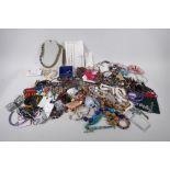 A quantity of costume jewellery including necklaces, bangles, earrings etc