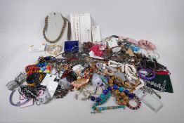 A quantity of costume jewellery including necklaces, bangles, earrings etc