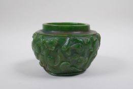 A Chinese reconstitued green hardstone pot with kylin decoration, 13cm diameter