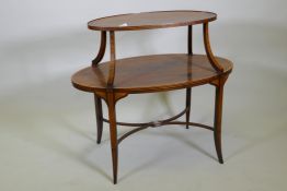 A C19th rosewood two tier etagere, banded and inlaid with satinwood, raised on sabre supports united