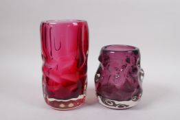 An amethyst studio glass vase and a similar cranberry studio glass vase, largest 7½" high