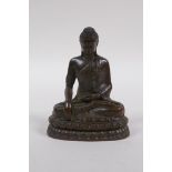 A bronze figure of Buddha seated in mediation, 9cm high