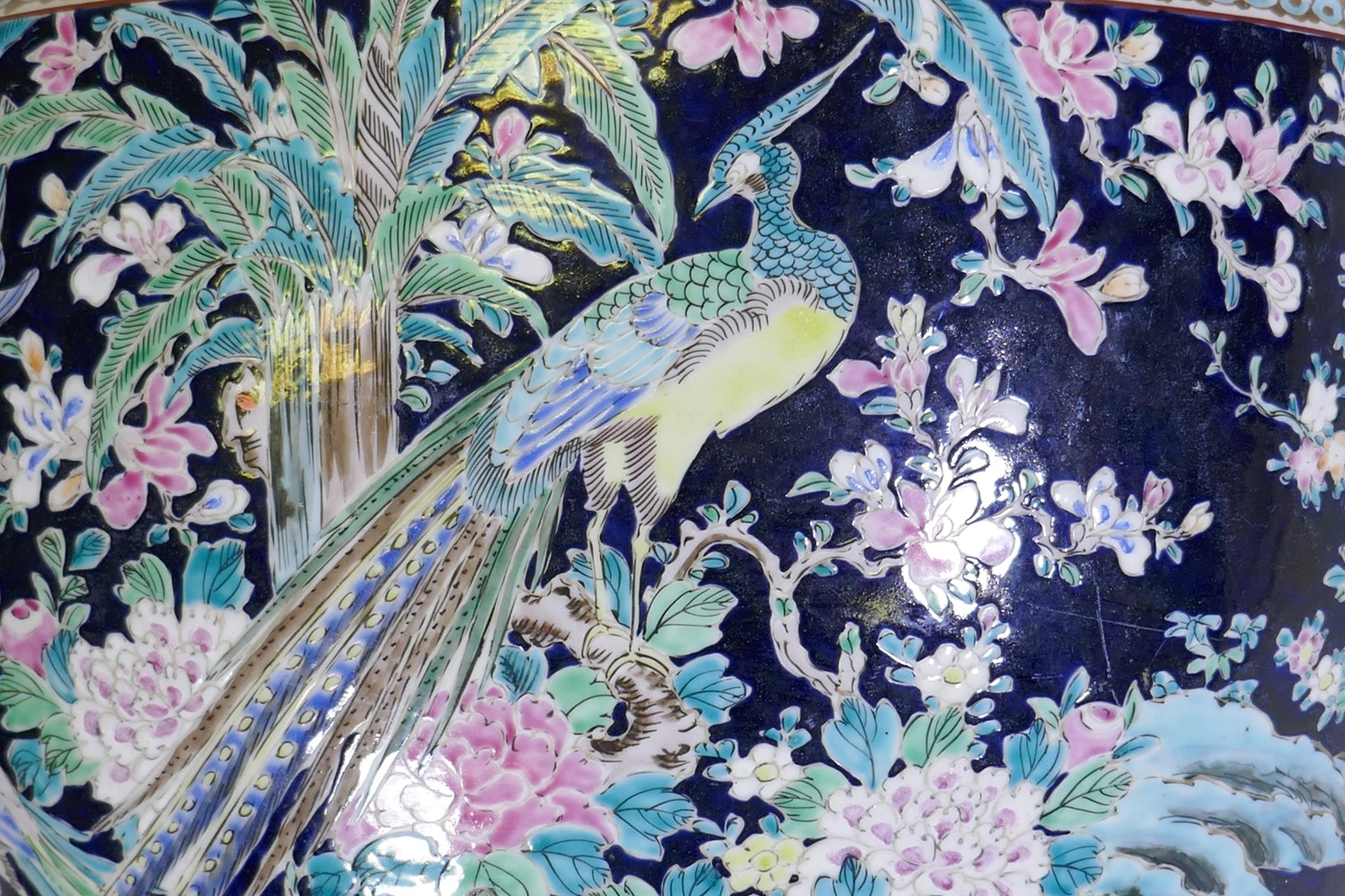 An antique Chinese famille noire ceramic jardiniere, decorated with exotic birds and flowers, 33cm - Image 7 of 7