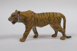 A cold painted bronze figure of a tiger, after Bergman, 11cm long