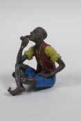 A Vienna style cold painted bronze of a pipe smoker, 6cm high