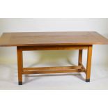 A bespoke Arts & Crafts style oak refectory table with cleated end plank top raised on square