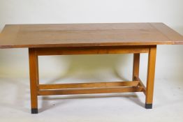 A bespoke Arts & Crafts style oak refectory table with cleated end plank top raised on square