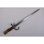 A late C19th French model 1880 short bayonet, manufactured in St Etienne, inscription to the