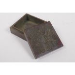 A Chinese bronze ink box, the cover with impressed character marks, 6 x 6cm