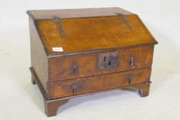 An early C18th walnut bible box with fall front and single drawer, raised on bracket supports,