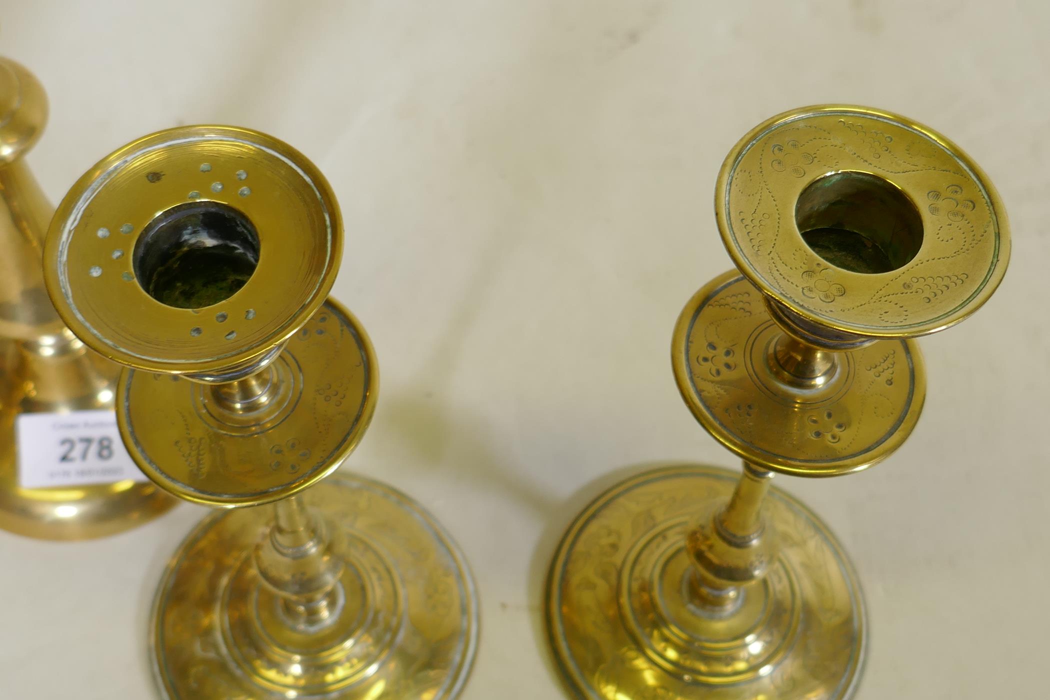 A pair of C18th/C19th  brass candlesticks, possible French/Flemish, with engraved decoration, - Image 3 of 5