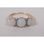 An antique gold ring set with three opals and diamonds, with a valuation appraisal, approx 1.5ct
