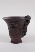 A Chinese faux horn bamboo libation cup, with kylin decoration, seal mark to base, 8cm high