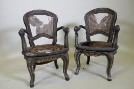 A pair of C18th/C19th child's elbow chairs with lacquered and carved parcel gilt decoration,