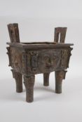 A Chinese archaic style bronze censer with five handles and moonface decoration, 17 x 12cm, 20cm