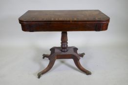 A Regency rosewood card table with Zebra wood crossbanded top, raised on a turned column with raised