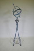 A patinated wrought metal armillary with bronze chapter ring, 150cm high