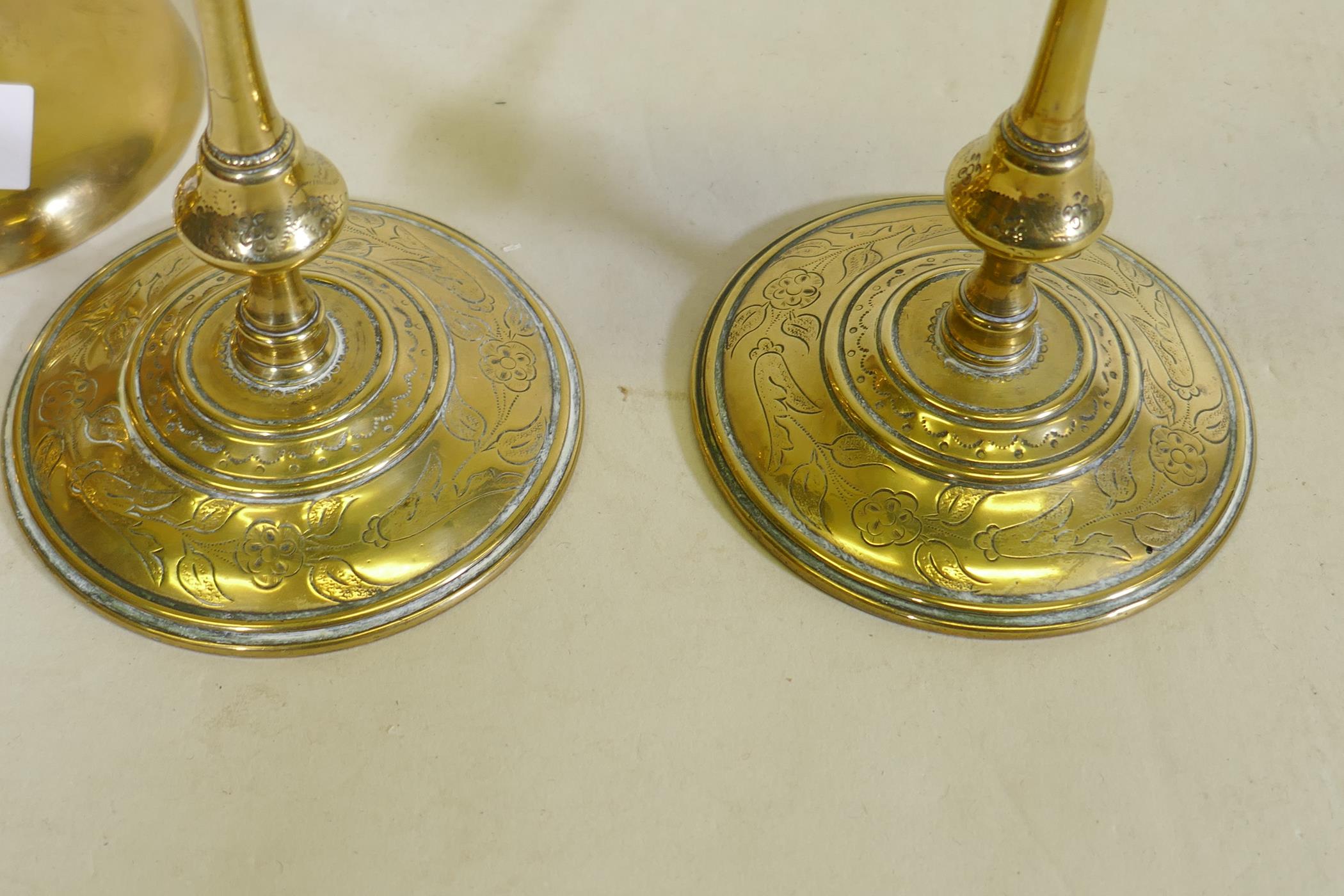 A pair of C18th/C19th  brass candlesticks, possible French/Flemish, with engraved decoration, - Image 2 of 5