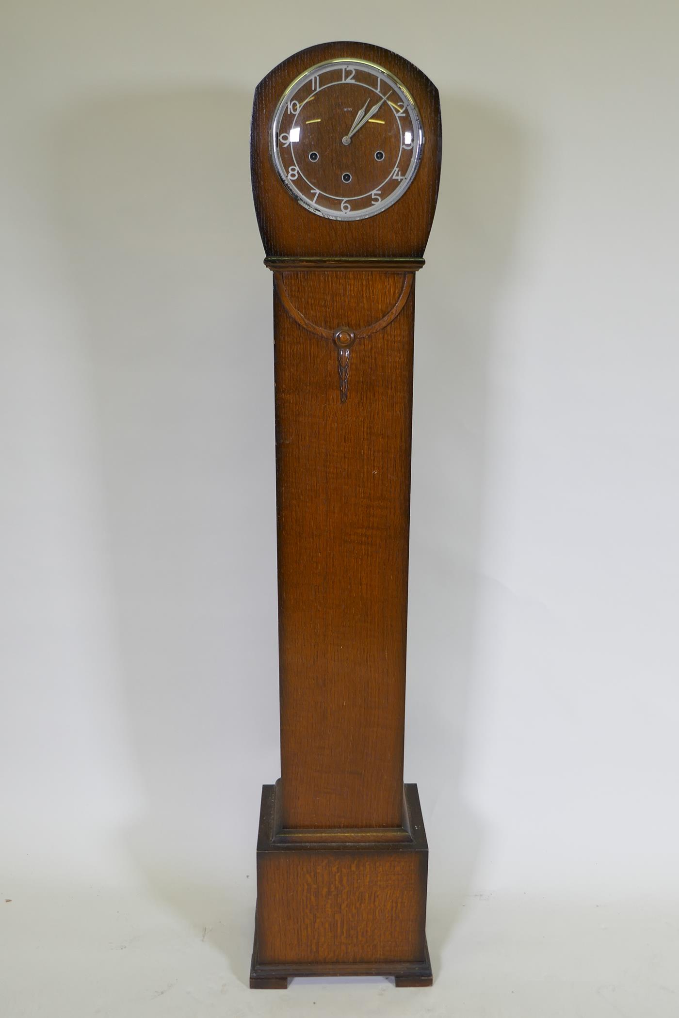 A 1960s Smiths grandmother clock, the eight day movement striking the Westminster chimes, with