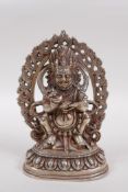 A Sino Tibetan white metal figure of a wrathful deity, 16cm high