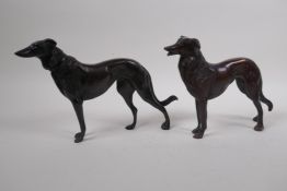 A pair of cast bronze hounds, 26cm long