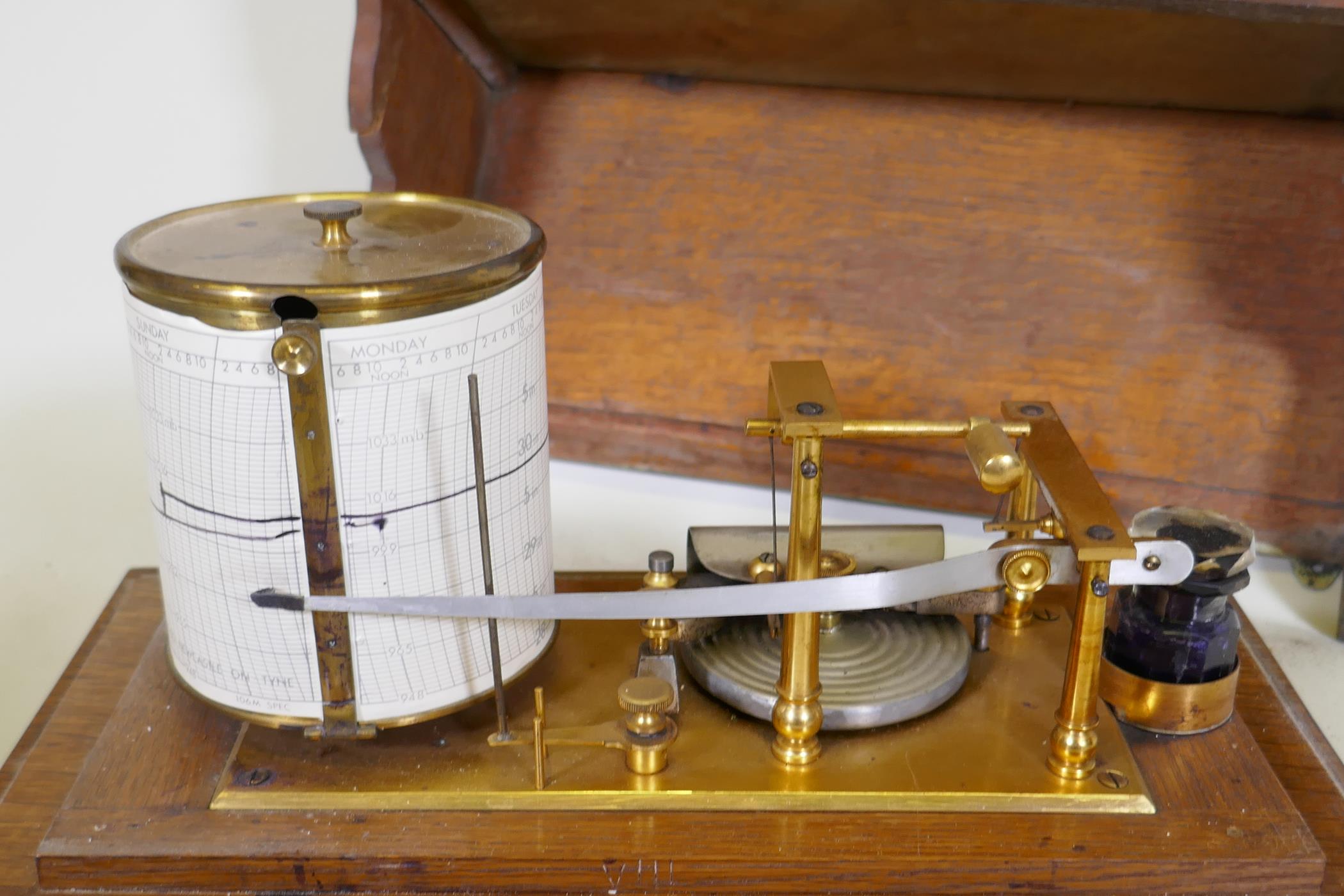 A brass barograph in a glazed oak case with wall bracket fitted with a drawer, glass cracked, drawer - Image 6 of 7