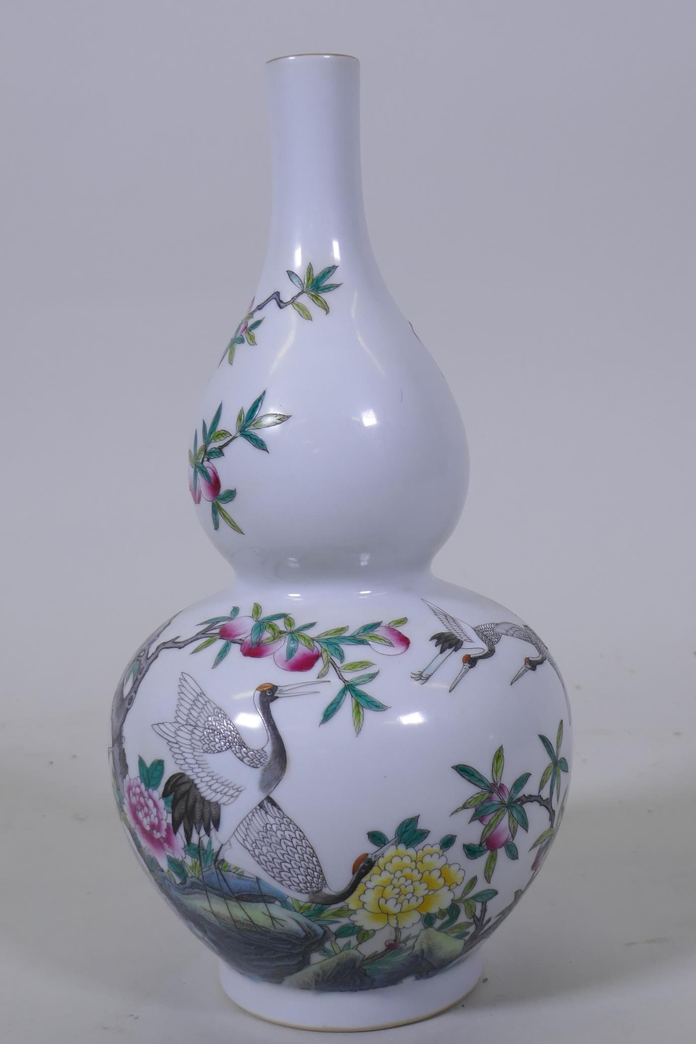 A Chinese double gourd shaped porcelain vase with enamel decoration depicting storks amongst peach - Image 3 of 4