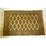 A gold ground Bokhara rug, 120 x 190cm