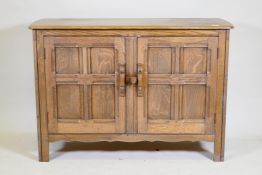 An Ercol 'Old Colonial' elm two door buffet, 122 x 45cm, 84cm high