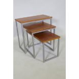 A contemporary nest of three tables, with veneered tops and metal supports, 57 x 29 x 54cm