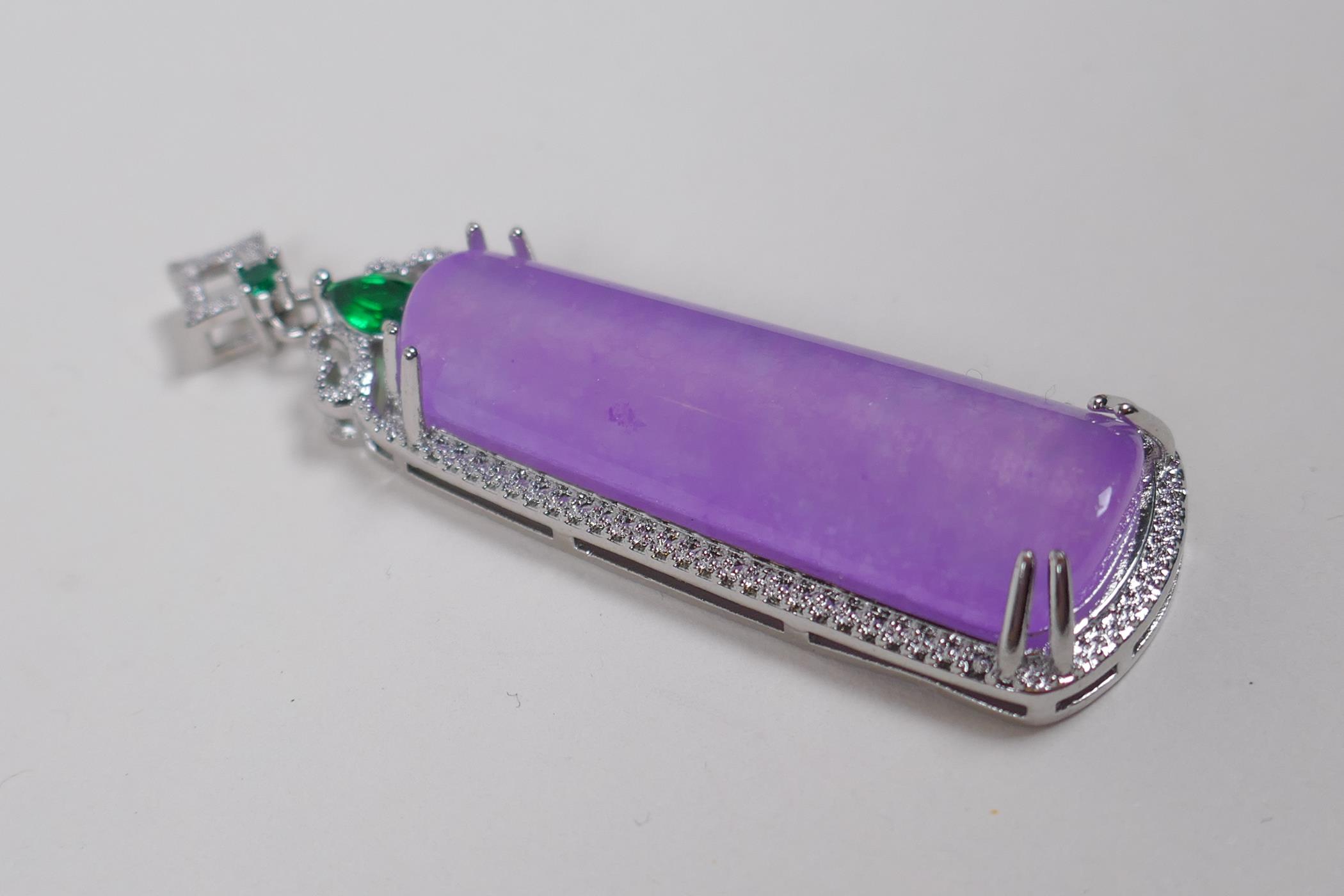 A white metal pendant set with a large amethyst coloured stone, cubic zirconia and green stones, 6cm - Image 2 of 2