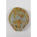 A Chinese nephrite jade belt buckle with carved dragon mask decoration, 8 x 9cm