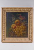 A C19th still life of fruit, oil on board, housed in an C18th carved pine frame, 28 x 34cm