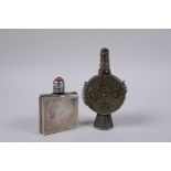 A Portuguese silver mounted glass scent bottle, and a white metal snuff bottle with filigree and