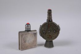 A Portuguese silver mounted glass scent bottle, and a white metal snuff bottle with filigree and