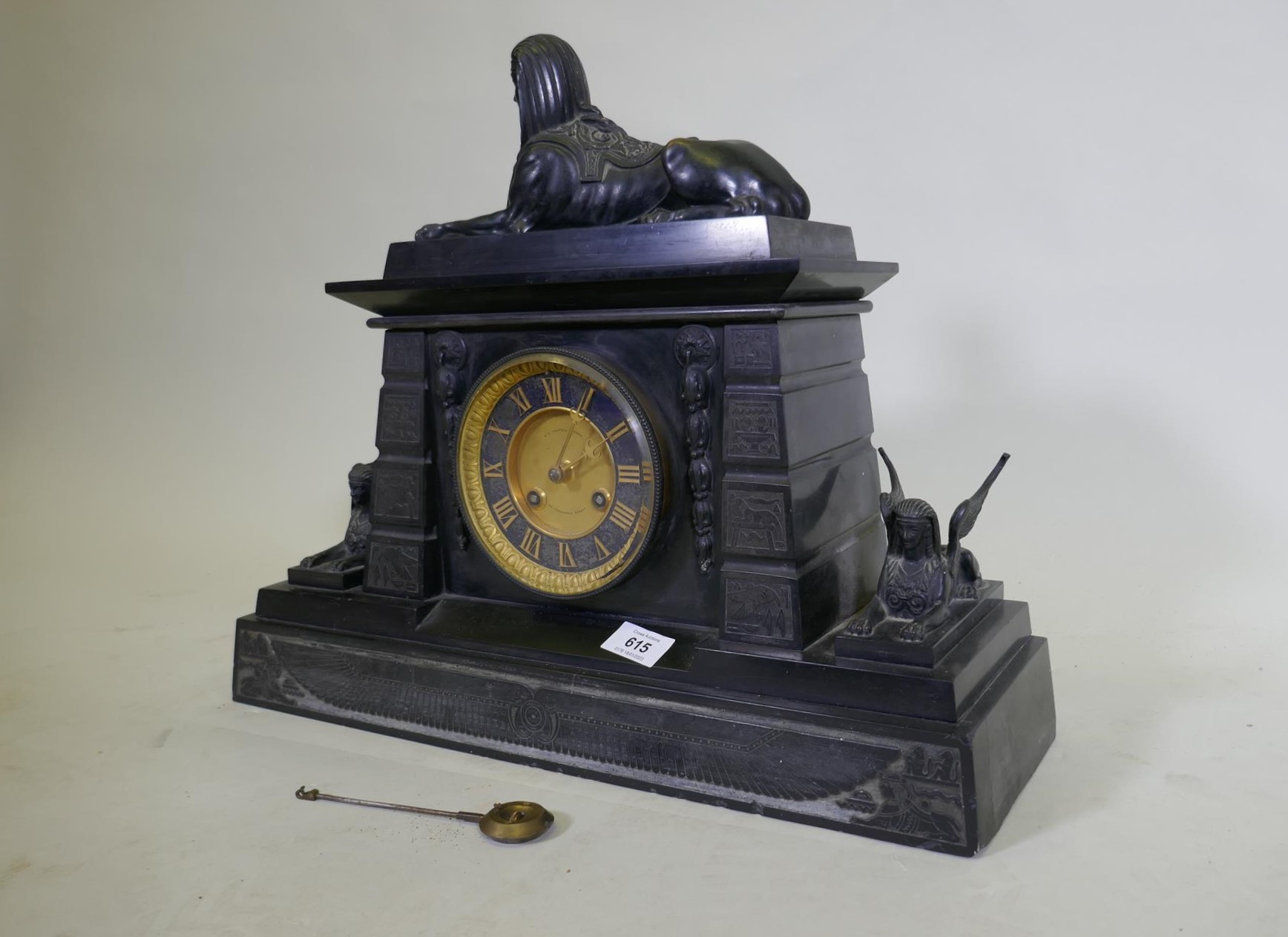 A C19th Egyptian Revival polished slate mantel clock, with patinated bronze mounts, the ormolu - Image 10 of 11
