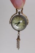 A brass and glass miniature ball clock pendant, 8cm drop