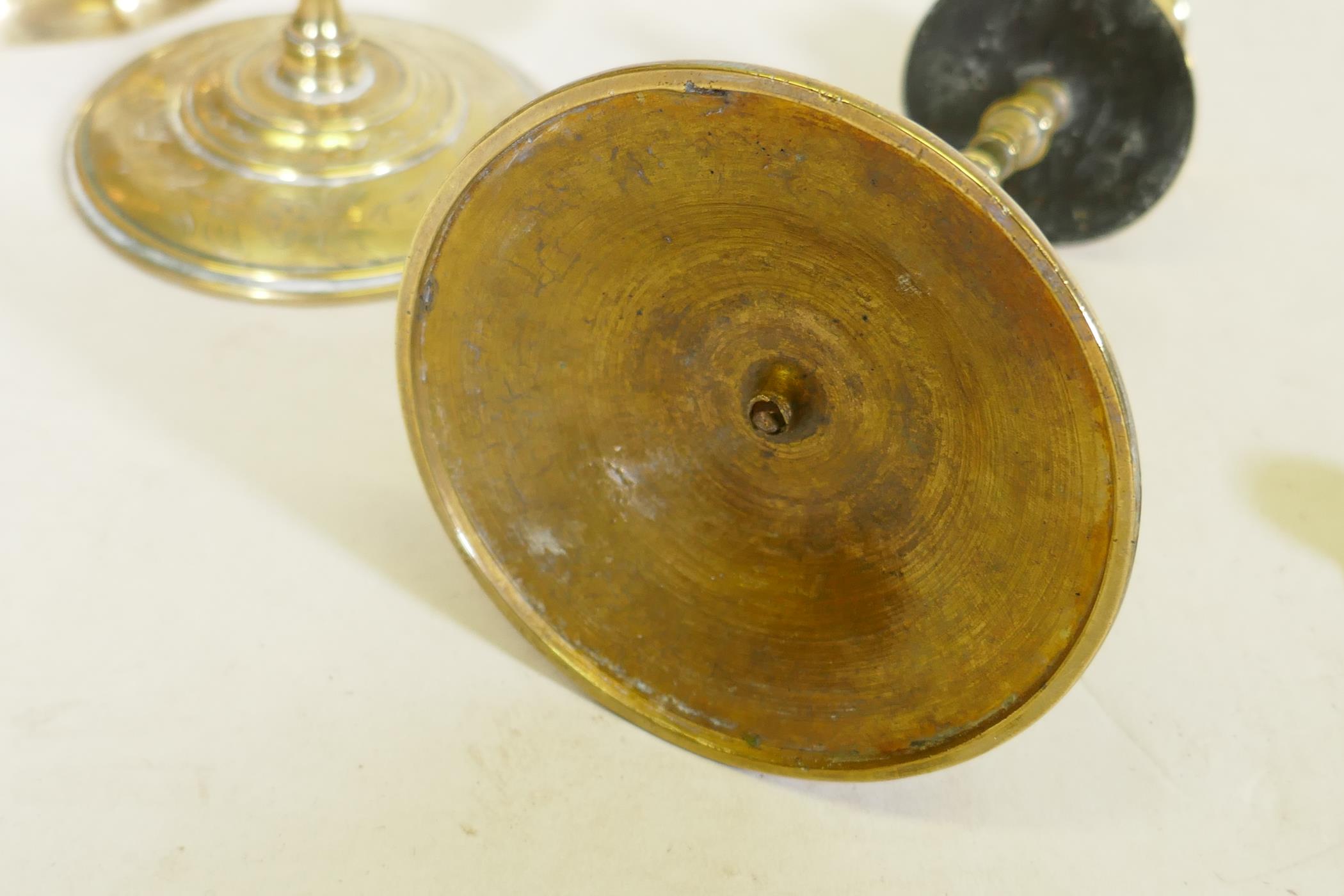 A pair of C18th/C19th  brass candlesticks, possible French/Flemish, with engraved decoration, - Image 5 of 5