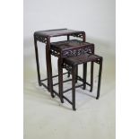 A nest of Chinese hardwood tables with carved dragon decoration, AF losses, largest 50 x 36, 72cm