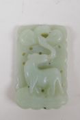 A Chinese carved celadon jade pendant with deer decoration, chip to ear, 3 x 5cm