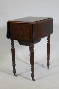 A William IV rosewood workbox, with shaped drop flaps, two drawers and pull out well, raised on