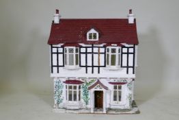 A scratch built dolls' house cottage, 68 x 42cm, 77cm high
