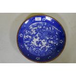 A blue and white transfer printed dish with red rim and phoenix decoration, 30cm diameter