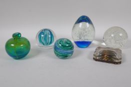 Five glass paperweights including a Caithness 'Blue Octavia', and a swirled art glass scent