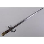 A late C19th French model 1880 bayonet, manufactured in St Etienne, inscription to the blade, the